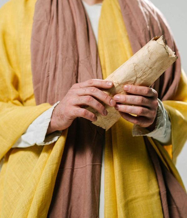 Ancient scrolls and symbols representing the wisdom of tantric yoga.