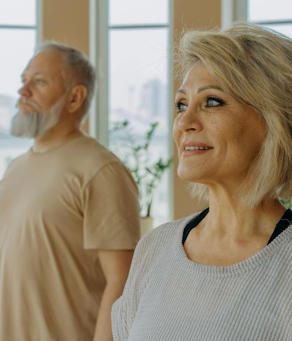 Diverse group of people of different ages starting a yoga class.