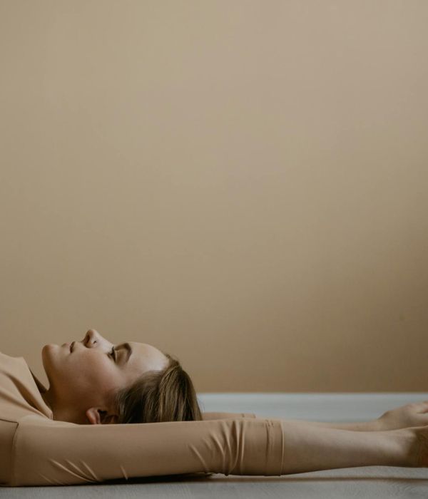 Woman in a peaceful yoga pose, embodying harmony and balance.